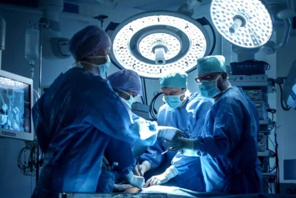 surgeons working in operating room